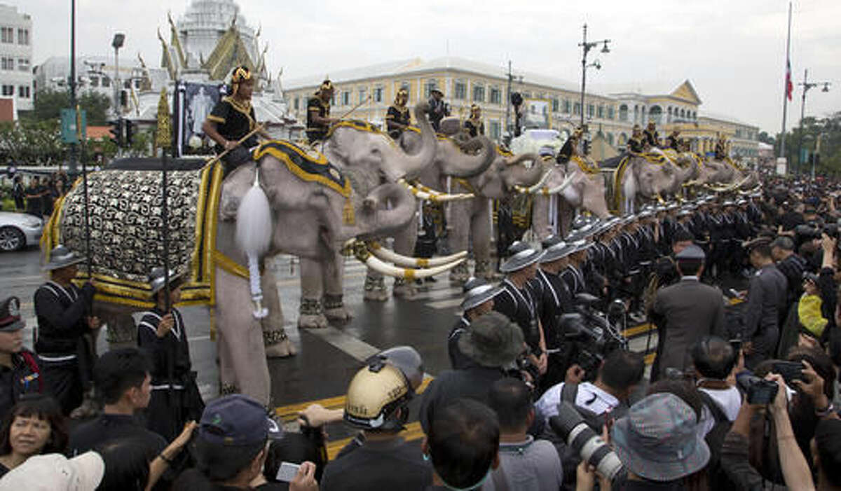 White elephants, mahouts pay respects to late Thai king