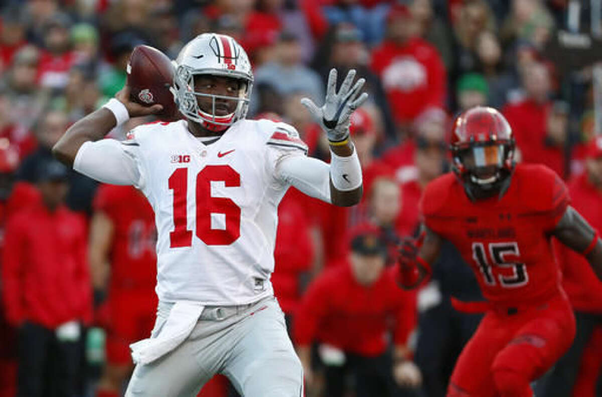 Ohio State quarterback J.T. Barrett (16) throws to a receiver in the first half of an NCAA college football game against Maryland in College Park, Md., Saturday, Nov. 12, 2016. (AP Photo/Patrick Semansky)