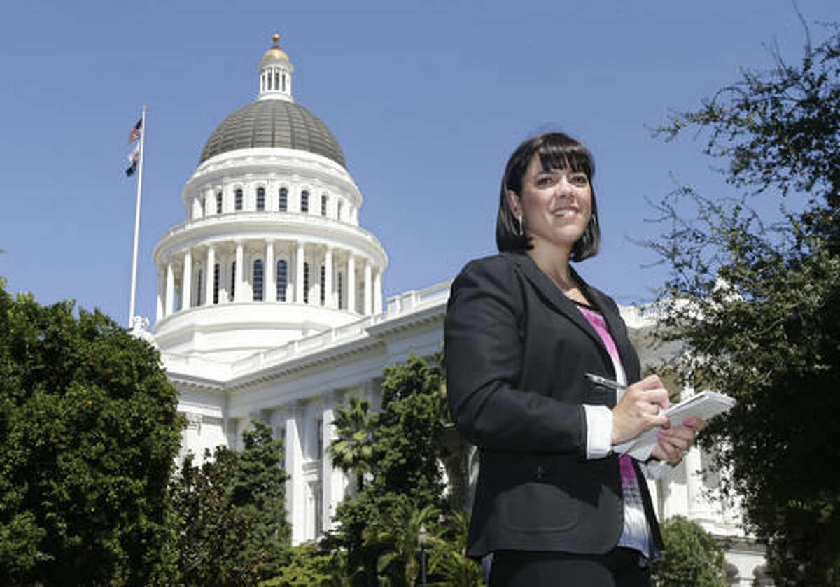 FILE - In this Aug. 21, 2013, file photo, Associated Press journalist Juliet Williams poses outside the state Capitol in Sacramento, Calif. Williams, who as Sacramento correspondent oversaw 2016 California election coverage for The Associated Press, has been named news editor in San Francisco. The appointment was announced Thursday, Nov.. 17, 2016. In her new role Williams will supervise AP staff in San Francisco and Fresno, and be responsible for news coverage throughout Northern California. (AP Photo/Rich Pedroncelli, File)