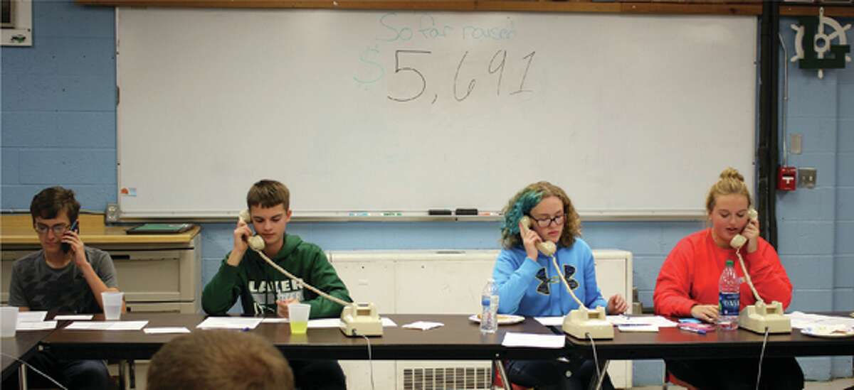   Laker FFA members Colin Truemner, Andrew Davis, Brittany Richmond and Miranda Farver call potential donors during the Living to Serve phone-a-thon, which brought in $11,837 over two days. (Submitted Photo)