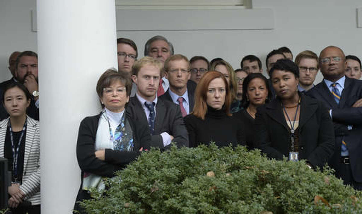 Staff listen as President Barack Obama speaks about the election results, Wednesday, Nov. 9, 2016, in the Rose Garden at the White House in Washington. Senior Adviser Valerie Jarrett, third from left, White House Communications Director Jen Psaki, center, and National Security Adviser Susan Rice, seventh from right, listen.(AP Photo/Susan Walsh)