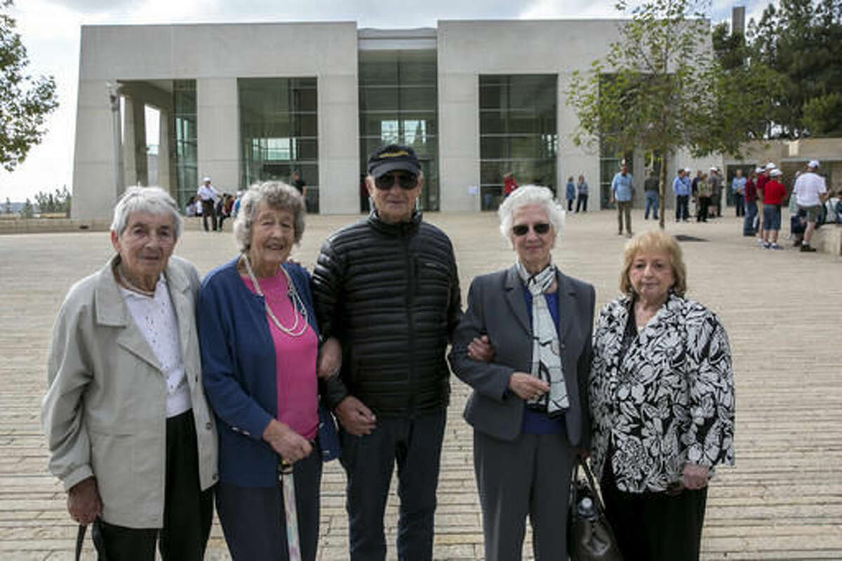 From left, Sonja Sternberg, her sister Gisela Feldman, Thomas Jacobson, Sonja Geismar, Eva Wiener passengers from the 1939 SS St. Louis trans-Atlantic ship, pose for a photograph during a visit to the Yad Vashem Holocaust memorial in Jerusalem Thursday, Nov. 17, 2016. The few remaining passengers from the famed 1939 SS St. Louis trans-Atlantic liner carrying nearly 1,000 Jewish refugees from Germany that was rejected by the United States and Cuba offer a unique perspective on today's refugee crisis. More than a quarter of the passengers ultimately perished in the Nazi death camps and the ship's saga became a symbol of Western indifference toward the victims of Nazi persecution. (AP Photo/Olivier Fitoussi) ISRAEL OUT