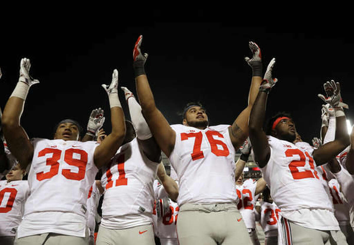 Ohio State players sing after an NCAA college football game against Maryland in College Park, Md., Saturday, Nov. 12, 2016. (AP Photo/Patrick Semansky)