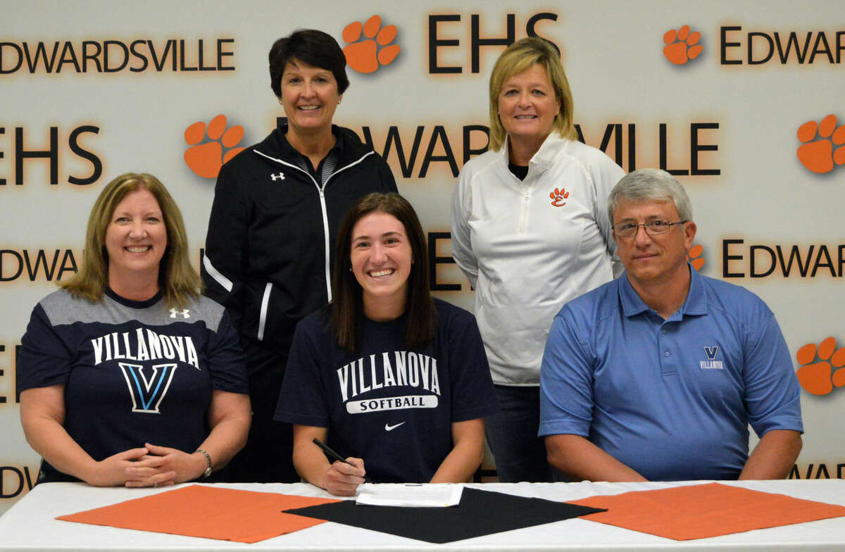 Edwardsville senior Sarah Hangsleben, seated center, will play softball for Villanova. She is sitting next to her parents, Sherri, right, and Mark. Standing are EHS head coach Lori Blade and assistant coach Donna Farley.