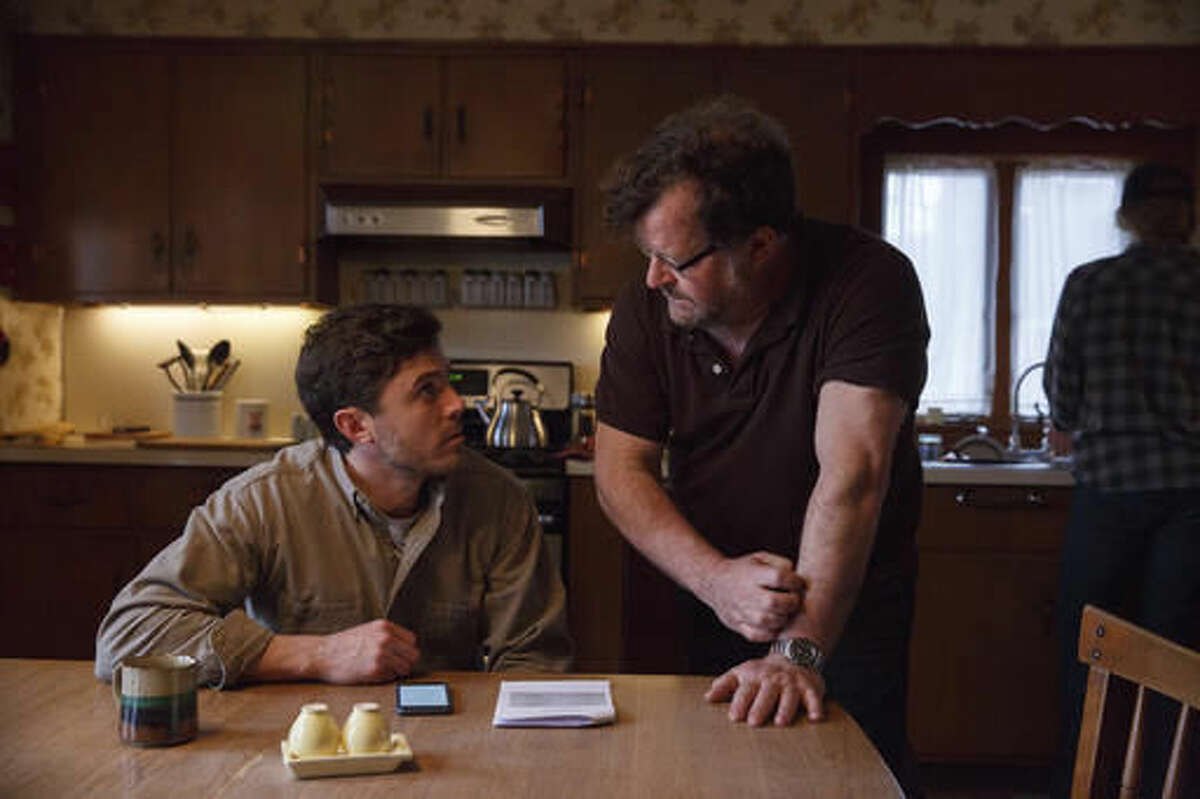 This image released by Roadside Attractions and Amazon Studios shows Casey Affleck, left, with writer-director Kenneth Lonergan during the filming of "Manchester By The Sea." (Claire Folger/Roadside Attractions and Amazon Studios via AP)