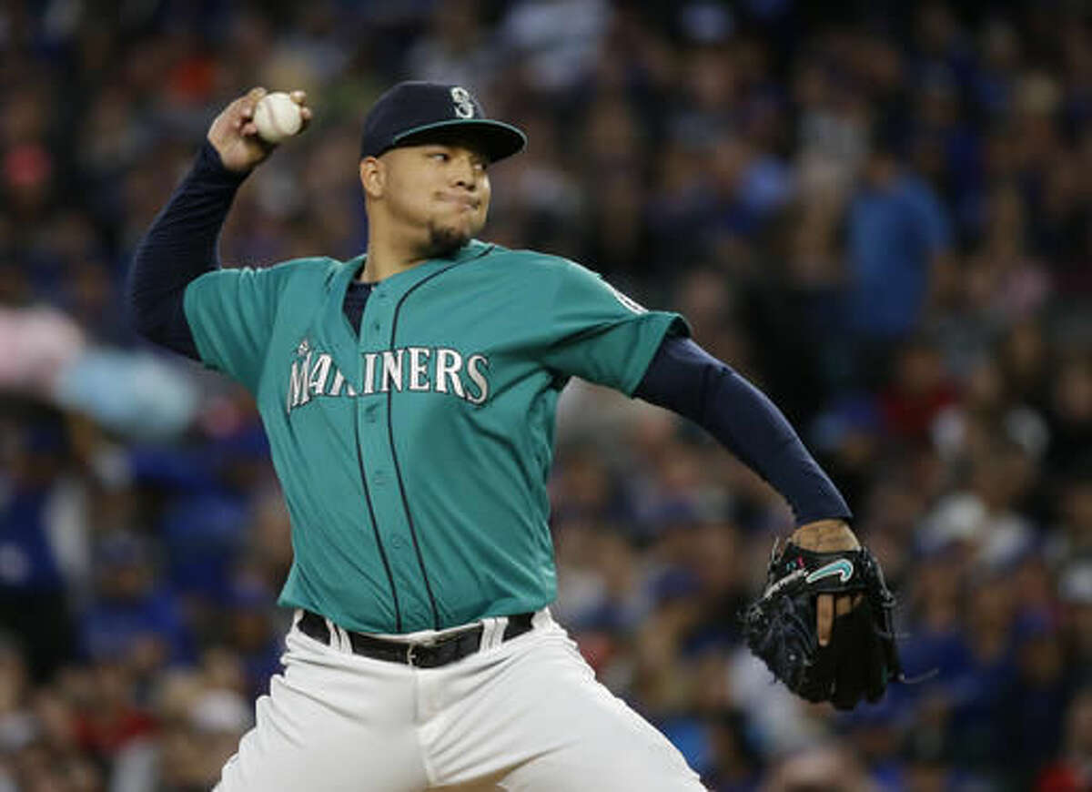 FILE - In this Sept. 19, 2016, file photo, Seattle Mariners starting pitcher Taijuan Walker throws against the Toronto Blue Jays in a baseball game in Seattle. Seattle and Arizona pulled off a five-player trade Wednesday night, Nov. 23, with the Mariners acquiring speedy infielder Jean Segura and the Diamondbacks getting right-hander Walker as the centerpieces of the deal. (AP Photo/Ted S. Warren, File)
