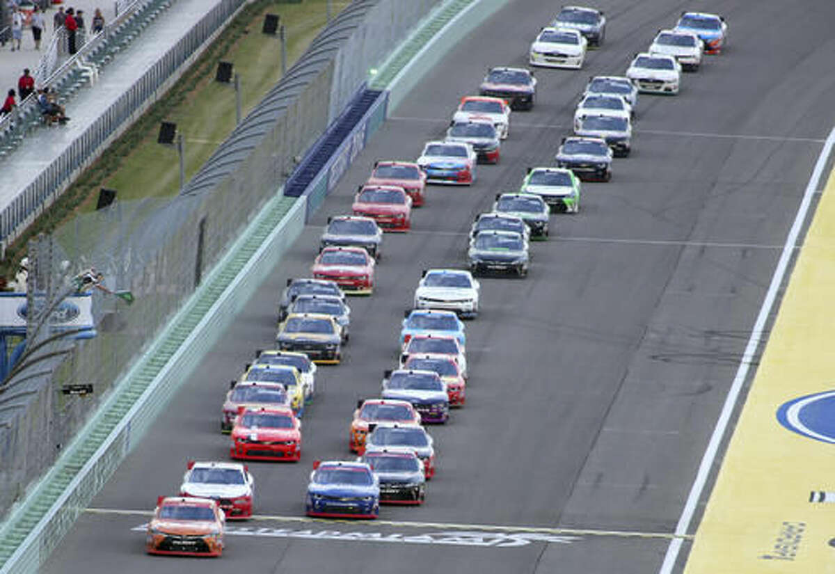 Drivers take the green flag for the start of the during the NASCAR Xfinity auto race, Saturday, Nov. 19, 2016, in Homestead, Fla. (AP Photo/Jim Topper)