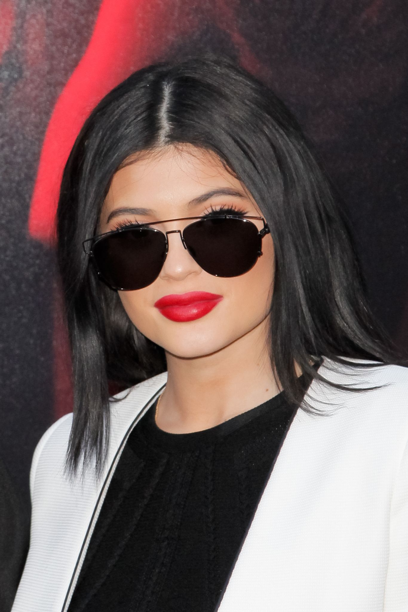 Kylie Jenner, left, and Travis Scott walks to their seats during the second  half in Game 2 of a first-round NBA basketball playoff series between the  Houston Rockets and the Minnesota Timberwolves