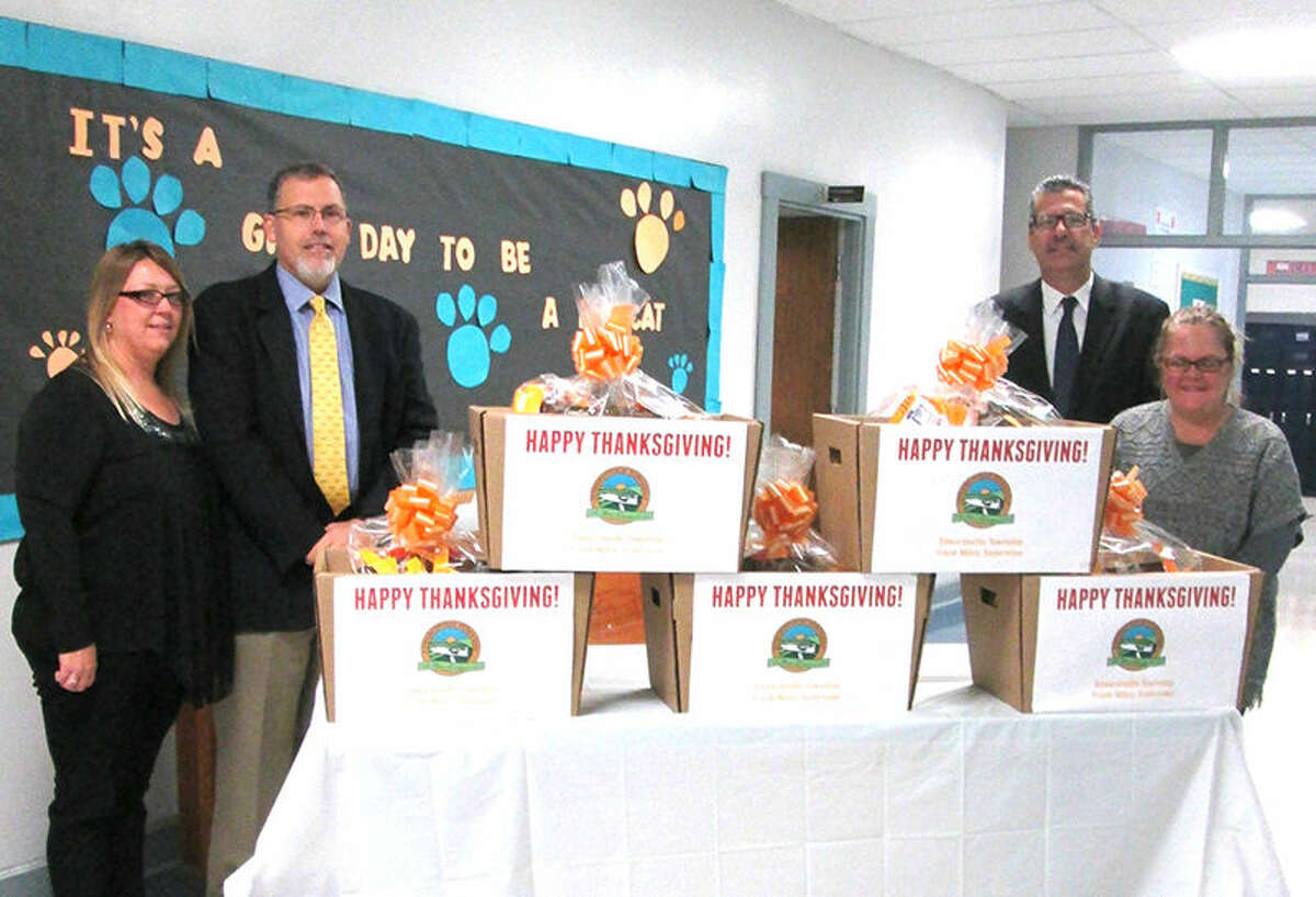 Township Supervisor Frank Miles, Community Outreach Coordinator Christine Doty, Principal Dr. Steve Stuart and Lincoln Middle School Nurse Lisa Bohnenstiehl present Thanksgiving Baskets to Lincoln Middle School.