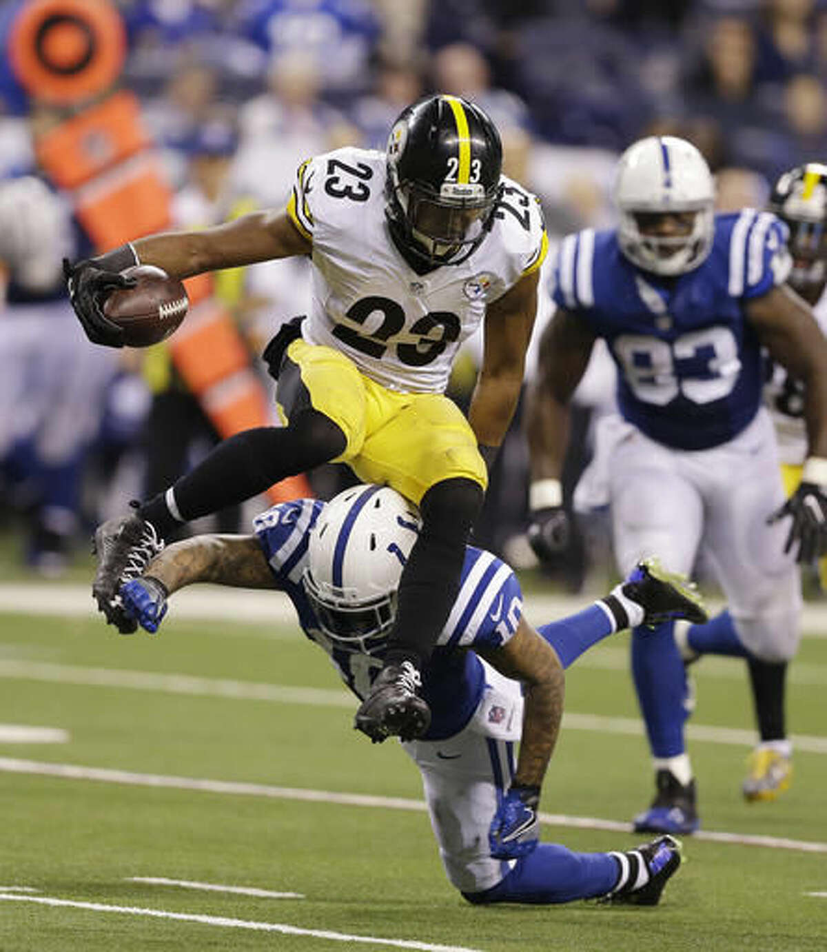 Pittsburgh Steelers' Mike Mitchell (23) jumps over Indianapolis Colts wide receiver Donte Moncrief (10) after making an interception during the second half of an NFL football game Thursday, Nov. 24, 2016, in Indianapolis. (AP Photo/Michael Conroy)