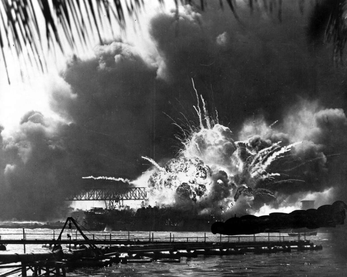 Smoke and flame are seen as the magazine explodes on the destroyer USS Shaw during the Japanese attack on Pearl Harbor, Hawaii, on Dec. 7, 1941.