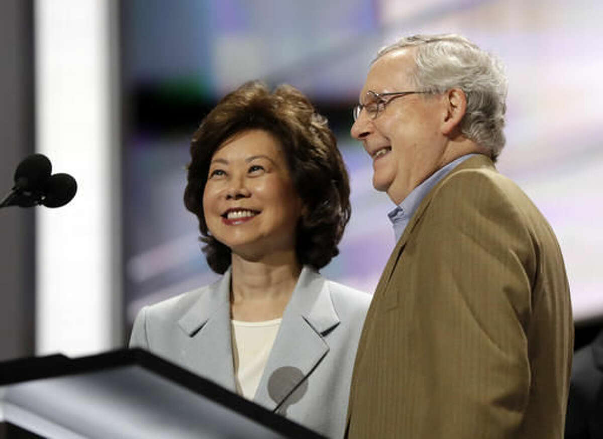 FILE - In this July 17, 2016 file photo, former Labor Secretary Elaine Chao and her husband, Senate Majority Leader Mitch McConnell, R-Ky., check out the stage during preparation for the Republican National Convention inside Quicken Loans Arena in Cleveland. President-elect Donald Trump has picked Elaine Chao to become transportation secretary, according to a Trump source. (AP Photo/Matt Rourke)