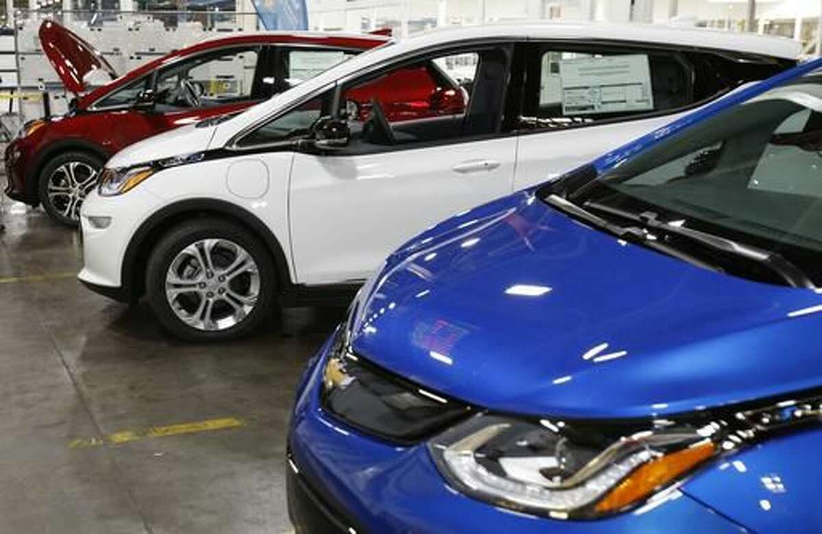 FILE - This Nov. 4, 2016, photo shows several Chevrolet Bolt EV vehicles during a tour of the General Motors Orion Assembly plant in Orion Township, Mich. (AP Photo/Duane Burleson)