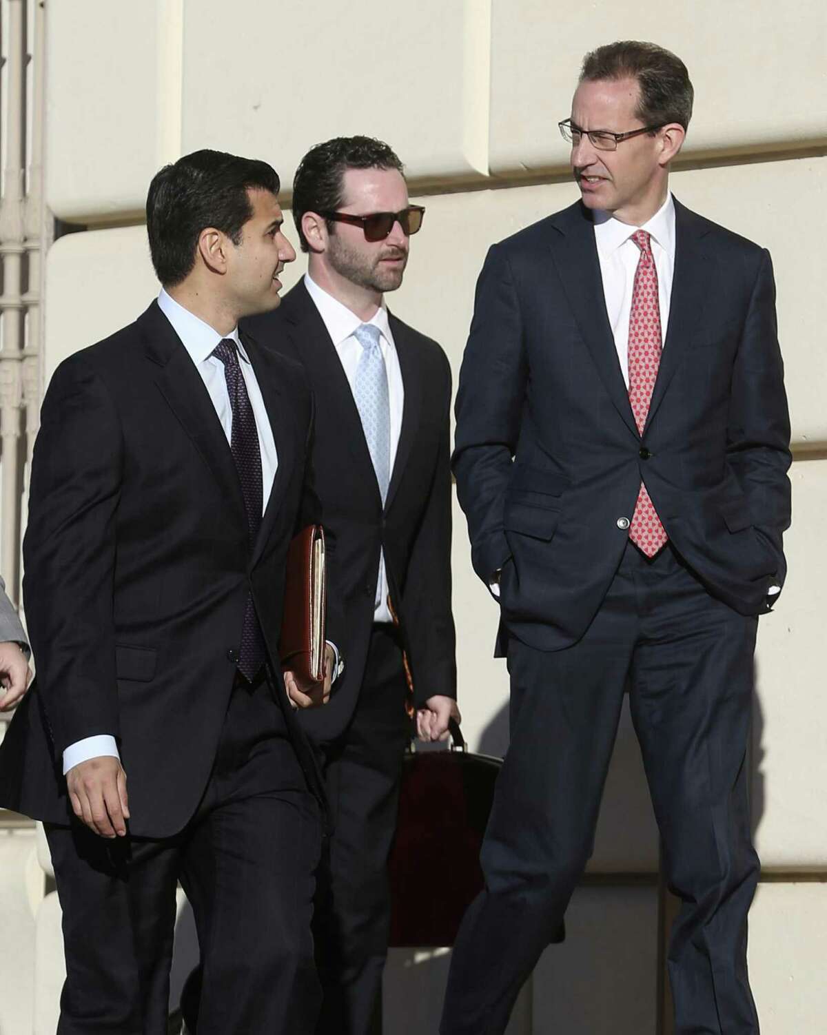 Attorney Todd Prins, right, accused of fabricating court documents and forging judges' signatures in clients' cases, arrives Tuesday morning, Dec. 6, 2016 at the Hipolito Garcia Federal Building and U.S. Courthouse for a creditors' meeting.