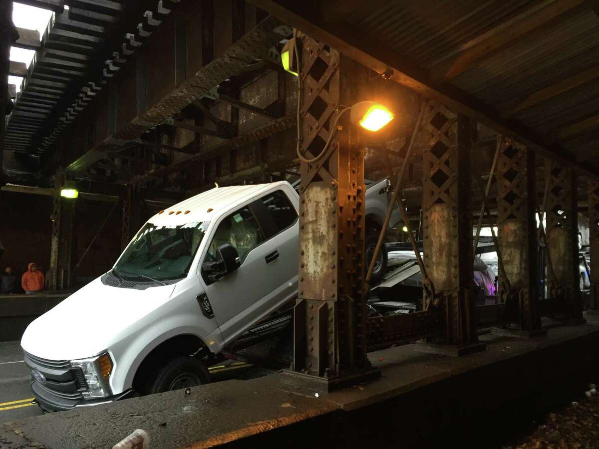 Car carrier strikes Stamford railroad bridge