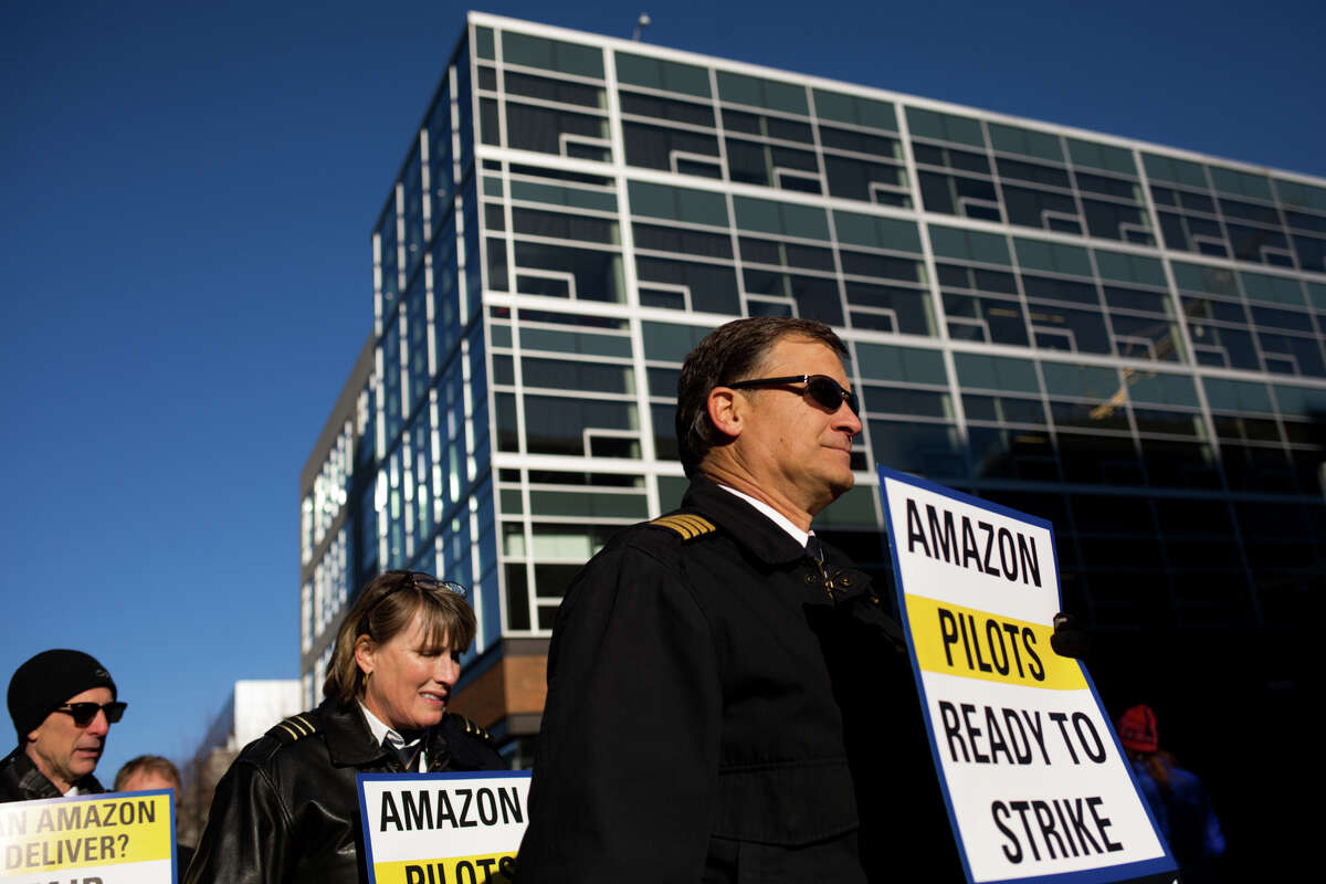 Pilots from Amazon shipping contractor AAWW protest understaffing and contractual delays outside Amazon headquarters in Seattle, Wednesday, Dec. 7, 2016.