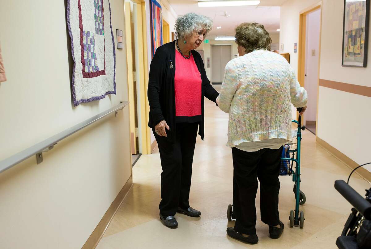 Olinda Marti-Volkoff, a Medicare recipient, (left) stops to talk with a friend while walking through the On Lok 30th Street Senior Center in San Francisco, Calif., on Friday, December 2, 2016. She visits the center almost every weekday for painting classes, dancing and to volunteer. House Speaker Paul Ryan has called for changing Medicare from the current plan, where the government pays the bills, to a defined payment plan, where seniors get a certain amount of money to buy private insurance. Studies have shown that likely means higher costs and less coverage for seniors.