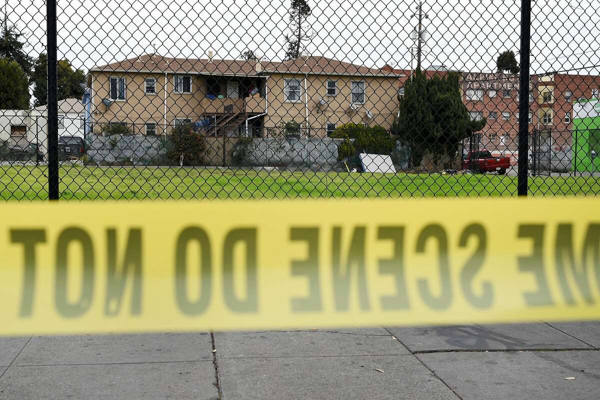 Apartments are seen behind crime scene tape on International Boulevard near the scene of the Ghost Ship artist warehouse fire in Oakland, CA, on Wednesday, December 7, 2016.