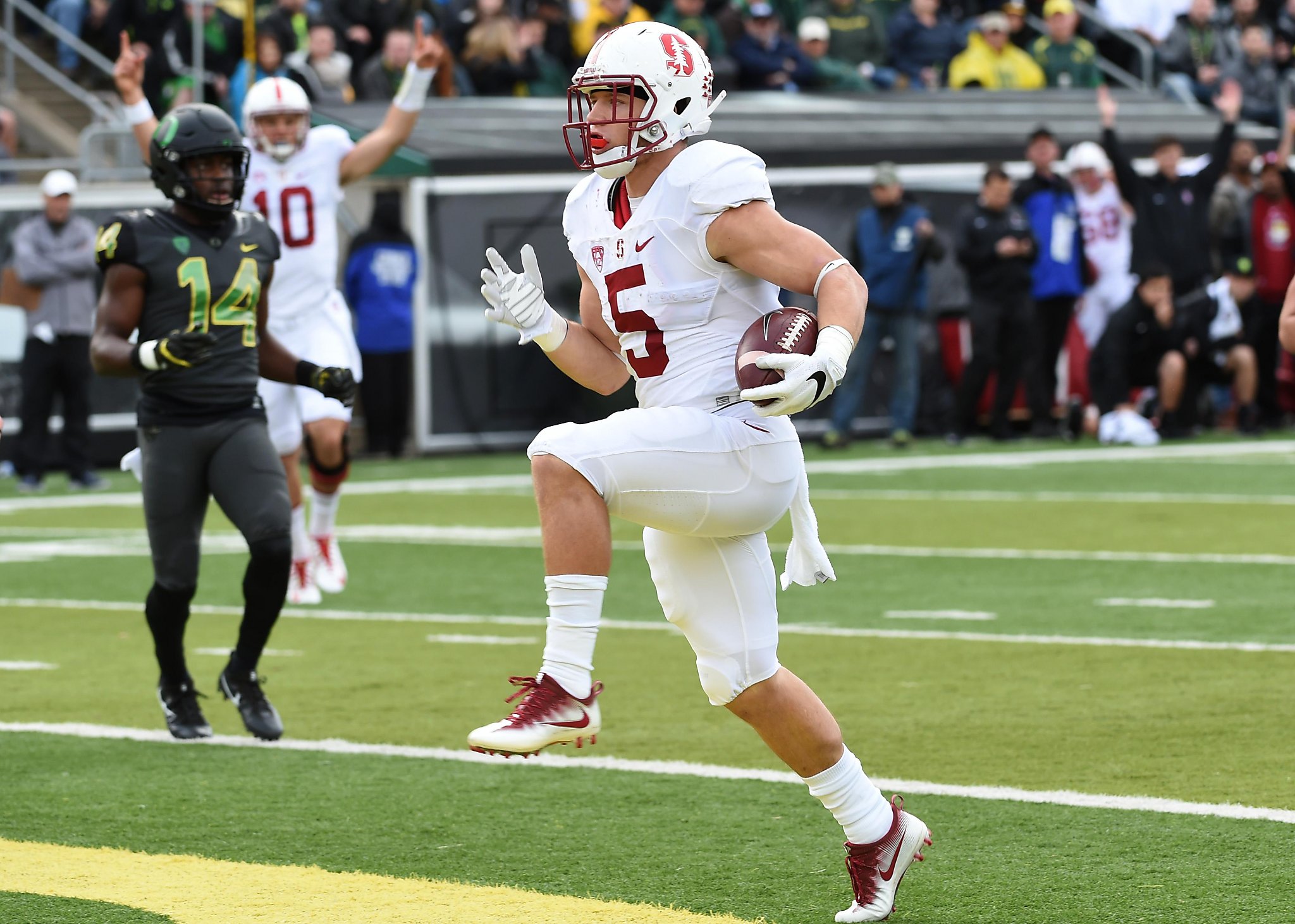 Christian McCaffrey of the Stanford Cardinal battles with Darrien News  Photo - Getty Images