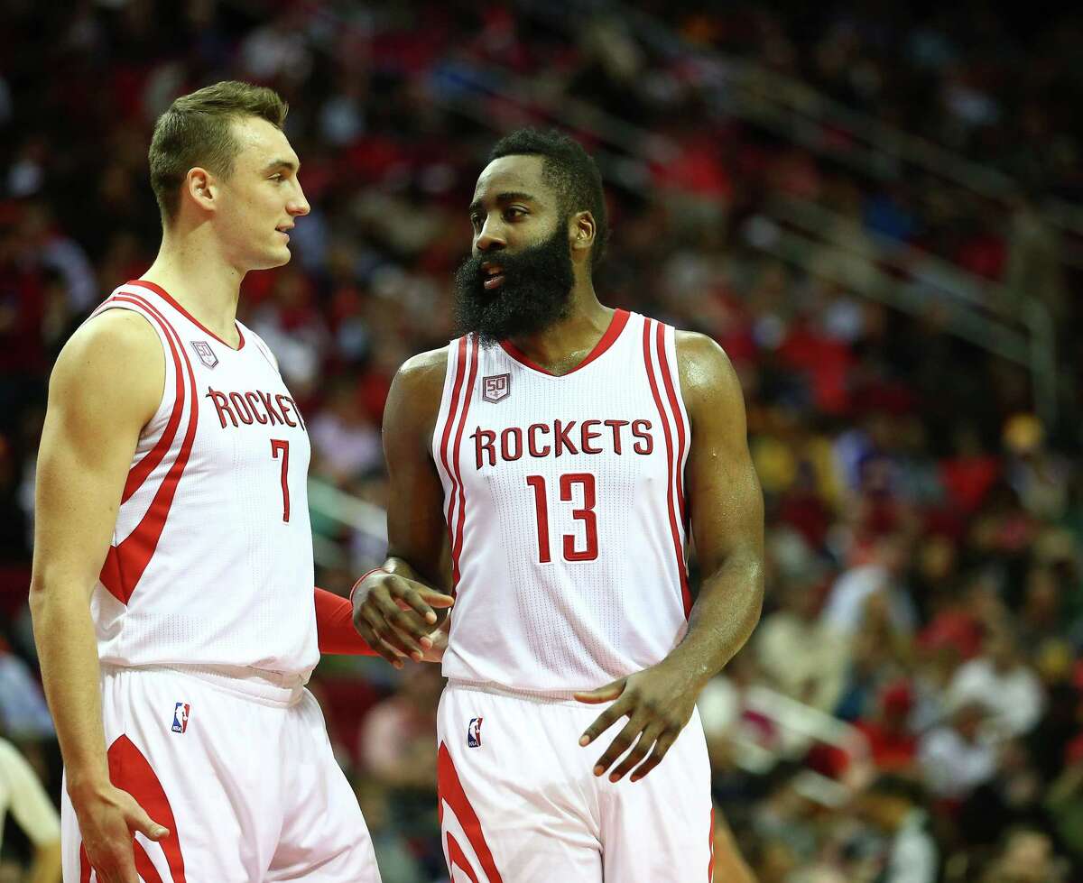 Houston Rockets forward Sam Dekker (7) talks with Houston Rockets guard James Harden (13) during the third quarter of an NBA game at the Toyota Center, Wednesday, Dec. 7, 2016, in Houston.