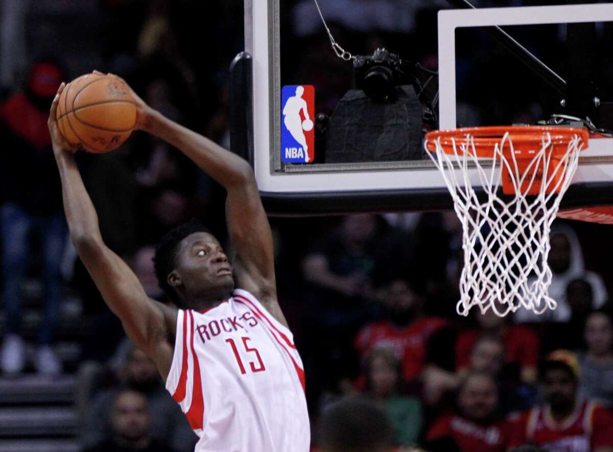 Houston Rockets center Clint Capela (15) catches a Houston Rockets guard James Harden (13) pass for a dunk during the Rockets game against the Boston Celtics at Toyota Center, Monday, Dec. 5, 2016, in Houston. ( Mark Mulligan / Houston Chronicle )