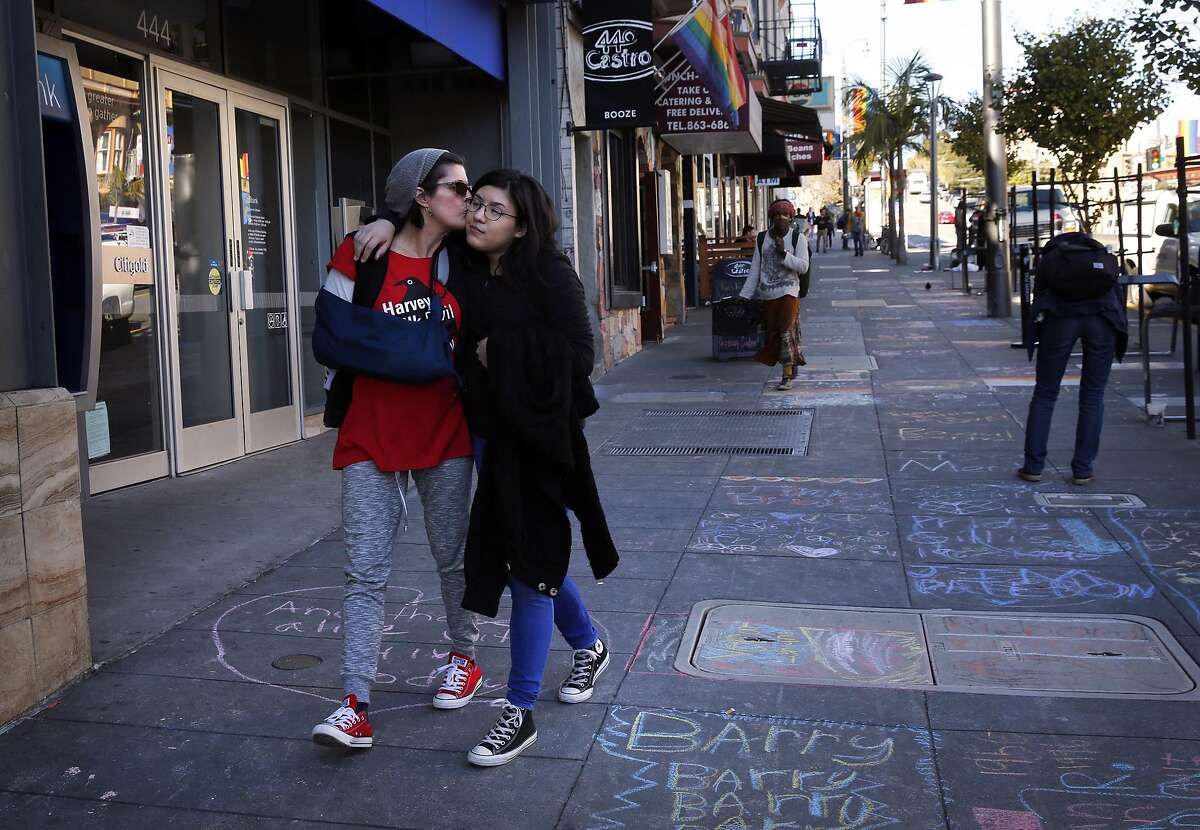 Patti Radigan, 59, kisses her daughter Angelica Tom�, 20, on the cheek after they participated in INSCRIBE, a sidewalk memorial to AIDs victims drawn along Castro street on World AIDs Day Dec. 1, 2016 in San Francisco, Calif. Radigan has been HIV positive for 25 years and has throughout her life been through many difficult times including drug addiction, prostitution and losing her first husband to a heart attack right in front of her. Though her third child was born while Radigan was HIV positive, the child, Angelica Tom�, turned out to be negative. It was the birth of Angelica that helped inspire Radigan to turn her life around.