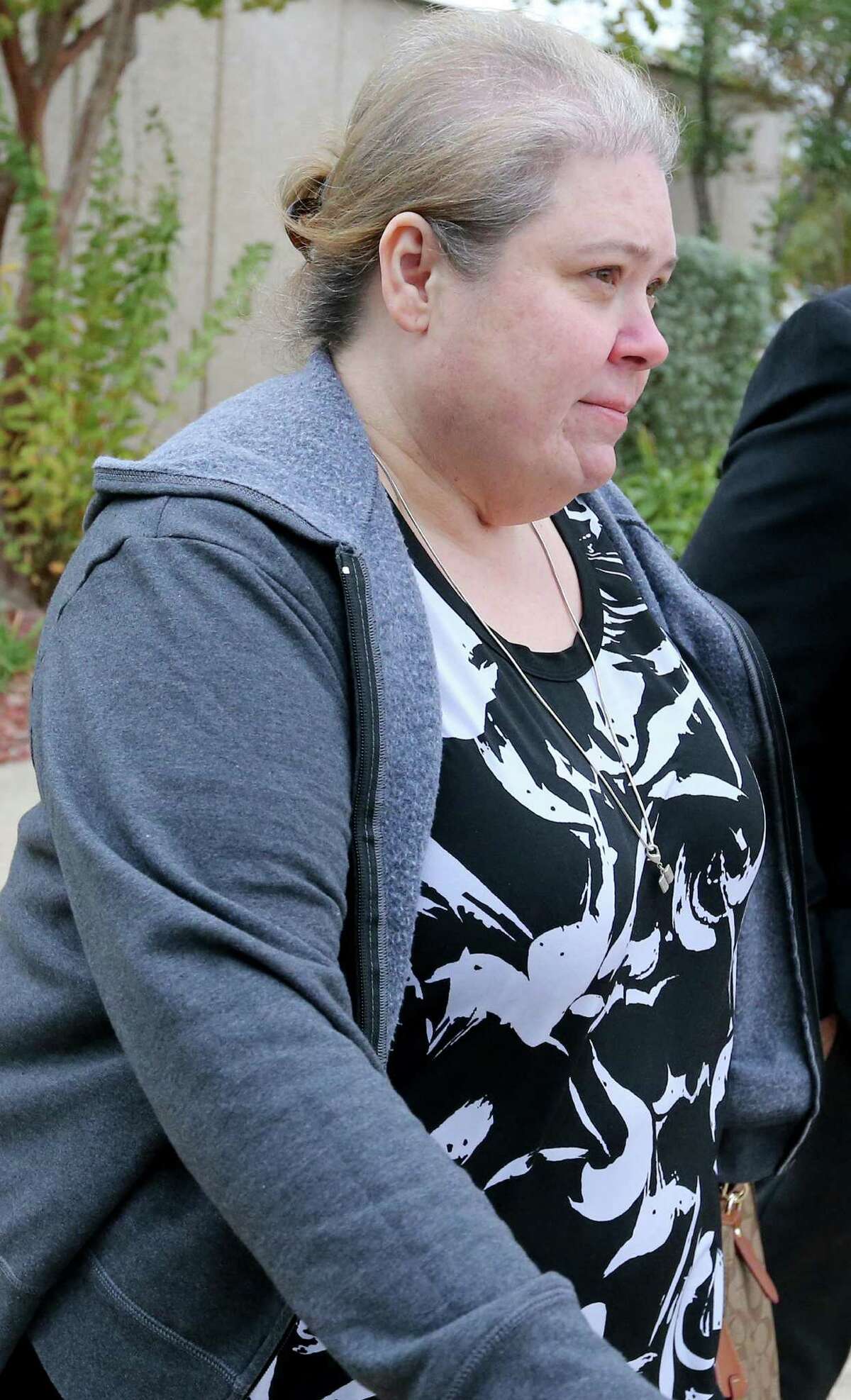 Former FourWinds Logistics Comptroller Laura Jacobs arrives Thursday at the the John Wood Federal Courthouse, where she pleaded guilty to a felony charge of conspiracy to commit wire fraud. She is the third ex-company official to plead guilty in a scheme to defraud investors.