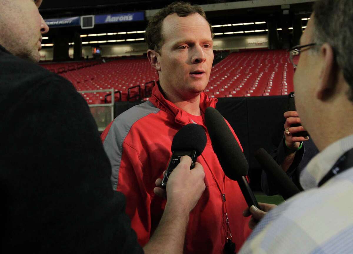 UH offensive coordinator Major Applewhite talks to reporters after Monday's practice at the Georgia Dome in Atlanta. ( Elizabeth Conley / Houston Chronicle )