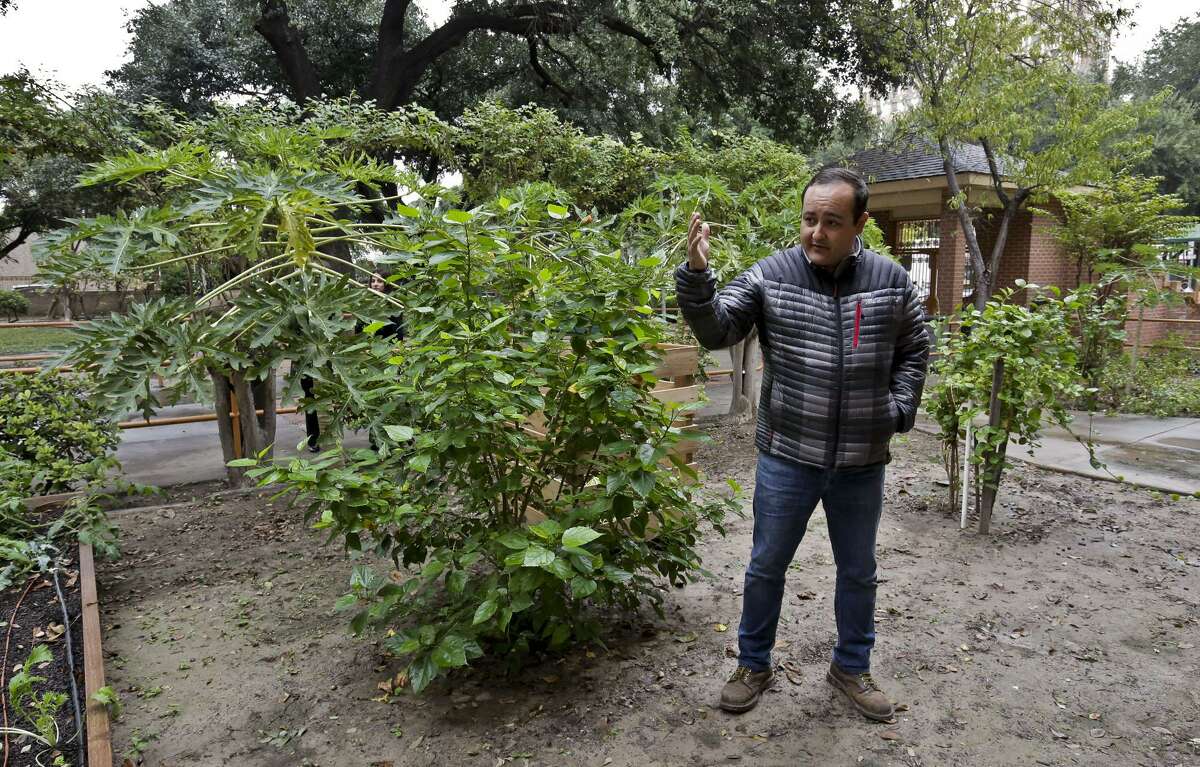 In this December file photo, Berman Rivera, from City Garten Landscape Design, gives a tour of the community garden located at the Laredo Senior Citizens Home.