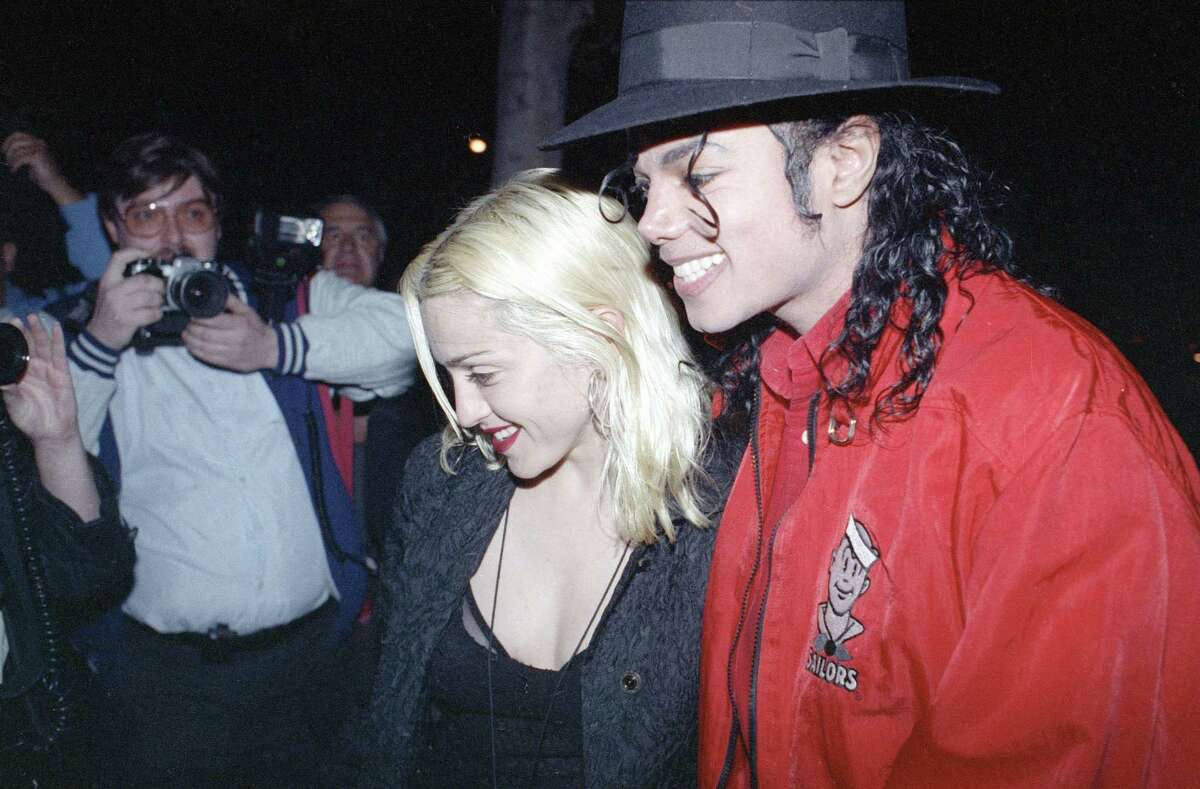 FILE - In this April 10, 1991, file photo, Madonna and Michael Jackson go out for dinner together at a restaurant in Los Angeles. Madonna told CBS' James Corden in an appearance on "The Late Late Show," Wednesday, Dec. 7, 2016, that she made out with Jackson once after giving him a glass of win. (AP Photo/Kevork Djansezian, File) ORG XMIT: PAPM106