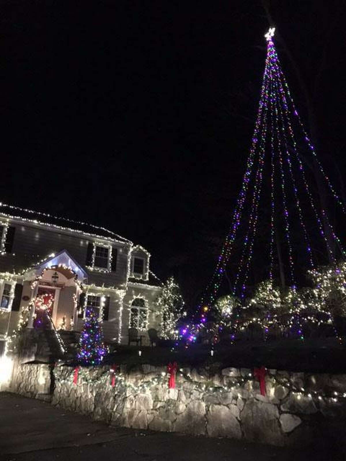 Ken Herrmann is big on decorating his home on Walnut Street in Cos Cob for the holidays. The day after Thanksgiving, he, sons Jason and Tyler and son-in-law Jamie Longo hung out the lights, a traditional job that takes the whole weekend.
