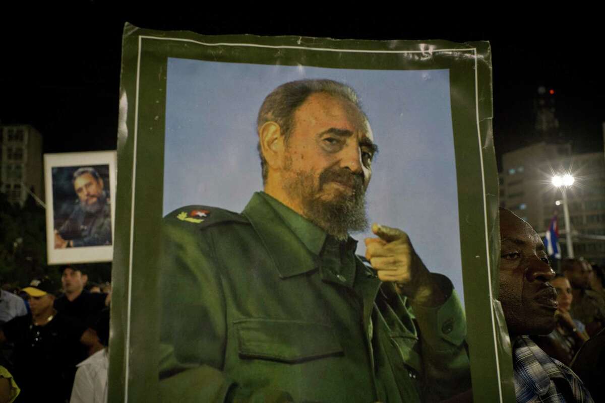 A picture of Fidel Castro is held during a rally honoring the late Cuban leader at the Revolution Plaza in Havana, Cuba on Nov. 29, 2016.