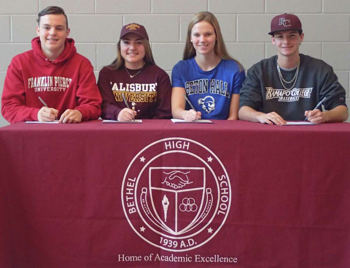 Four Bethel High School student-athletes finalized their college plans during a signing-day ceremony at the school Dec. 9, 2016. From left, Luke Newman will attend Franklin Pierce and play lacrosse; Ariana Leggio will attend Salisbury University and play tennis; Amelia Wootton will attend Seton Hall University and compete with the swimming and diving team; and Stephen Spinella will attend Ramapo College and play baseball.