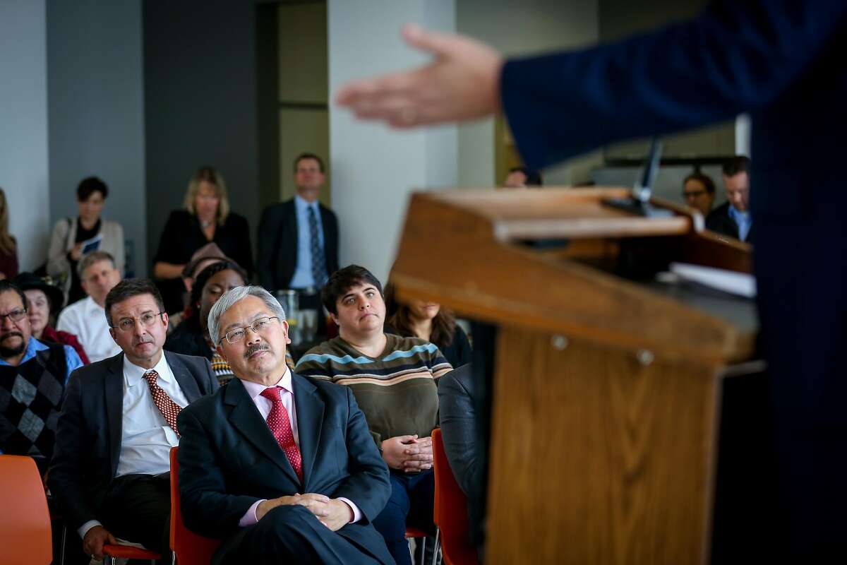Ed Lee listens while CEO of Salesforce Marc Benioff speaks at the press conference announcing the Heading Home campaign on Friday, December 9, 2016 in San Francisco, Calif.