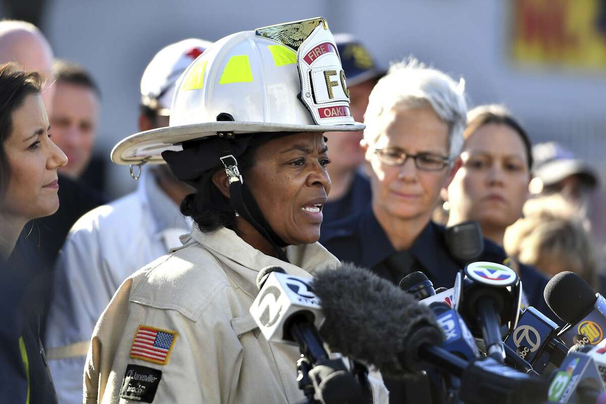Oakland Fire Chief Teresa Deloach Reed speaks to members of the media after a deadly fire tore through a warehouse during a late-night electronic music party in Oakland, Calif., Saturday, Dec. 3, 2016. Officials described the scene inside the warehouse, which had been illegally converted into artist studios, as a death trap that made it impossible for many partygoers to escape the Friday night fire. (AP Photo/Josh Edelson)