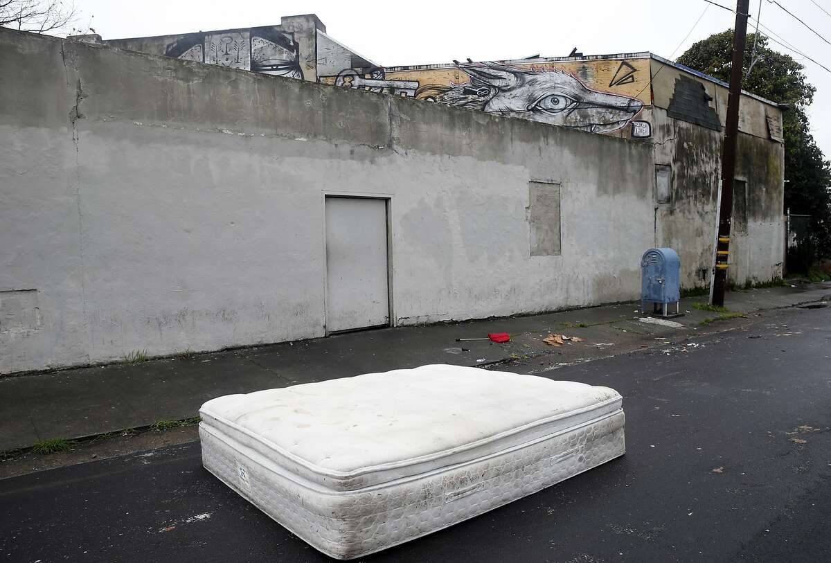 A mattress is abandoned on Espee Avenue in front of the Burnt Ramen underground music club in Richmond, Calif. on Friday, Dec. 9, 2016. Mayor Tom Butt described the venue as Richmond's version of the Ghost Ship, the Oakland artist collective where 36 people died in a fire during an electronic music party last weekend.