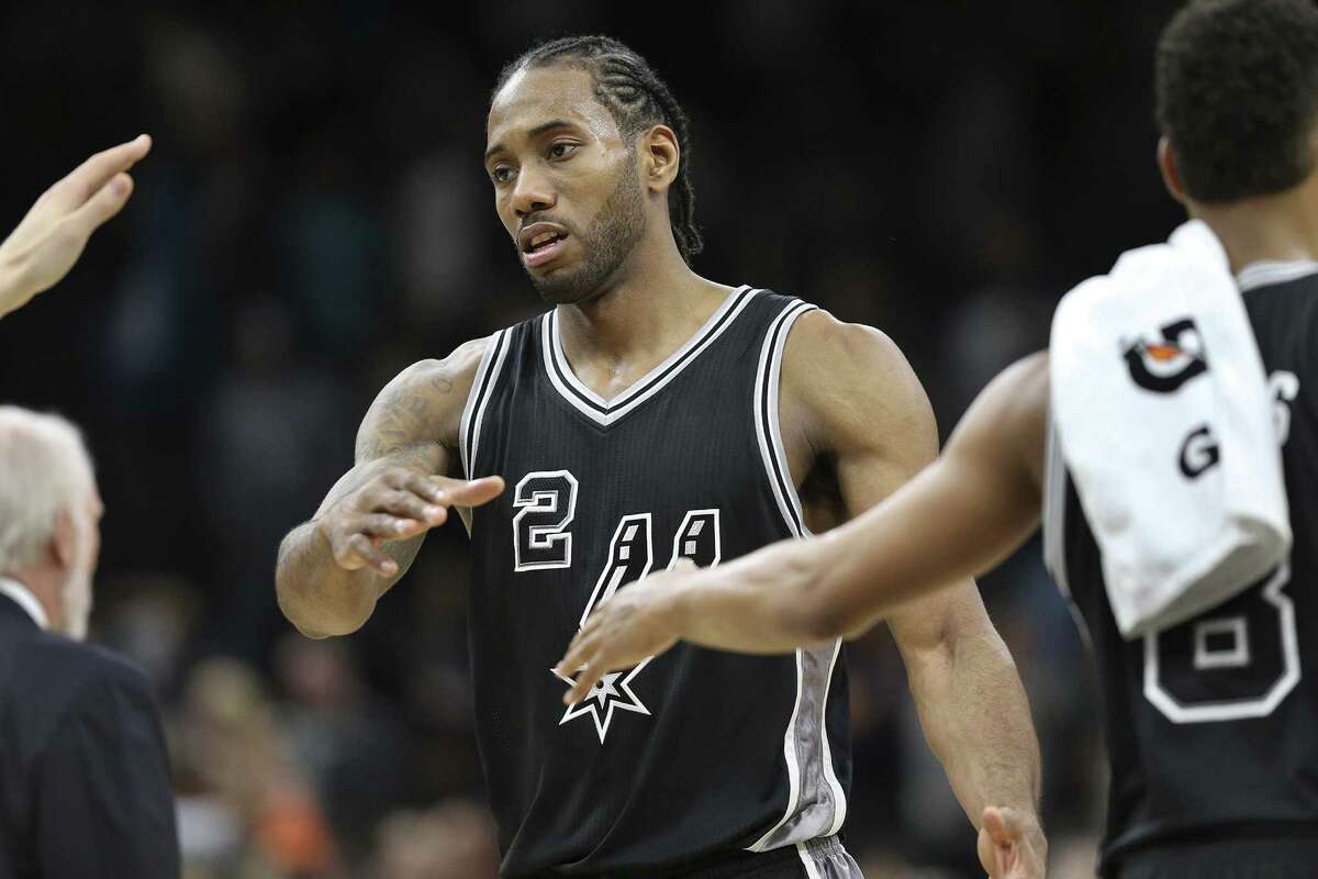 Kawhi Leonard takes congratulations after singking a game winning shot as the Spurs host Washington at the AT&T Center on December 2, 2016.