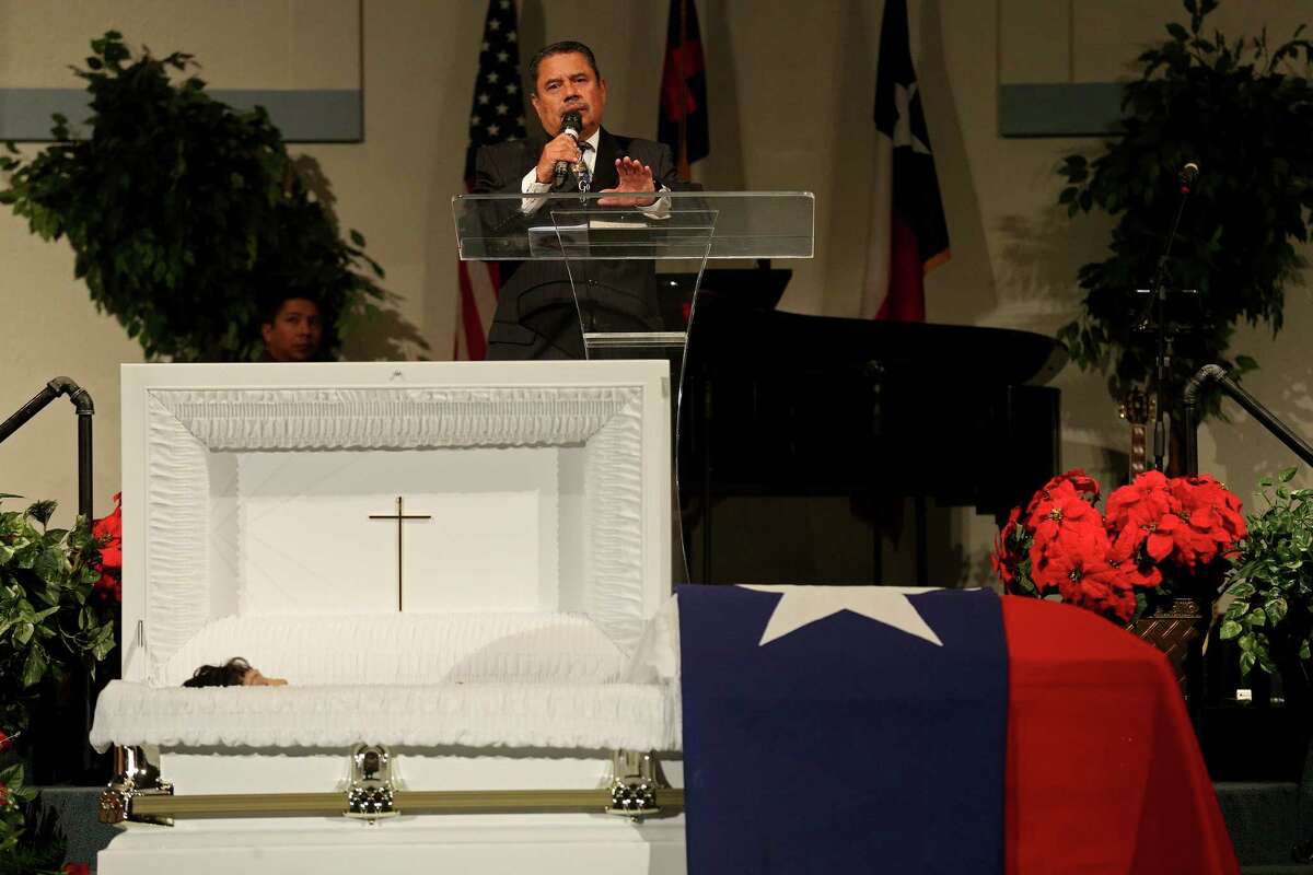 Pastor Israel Solis leads the funeral service for his sister Bexar County Sheriff's Office Deputy Doralinda Solis Nishihara held Friday Dec. 9, 2016 at Sendero Assembly of God Church. BCSO Deputy Doralinda Solis Nishihara died after driving her vehicle into a large sinkhole Sunday evening on the Southwest Side.