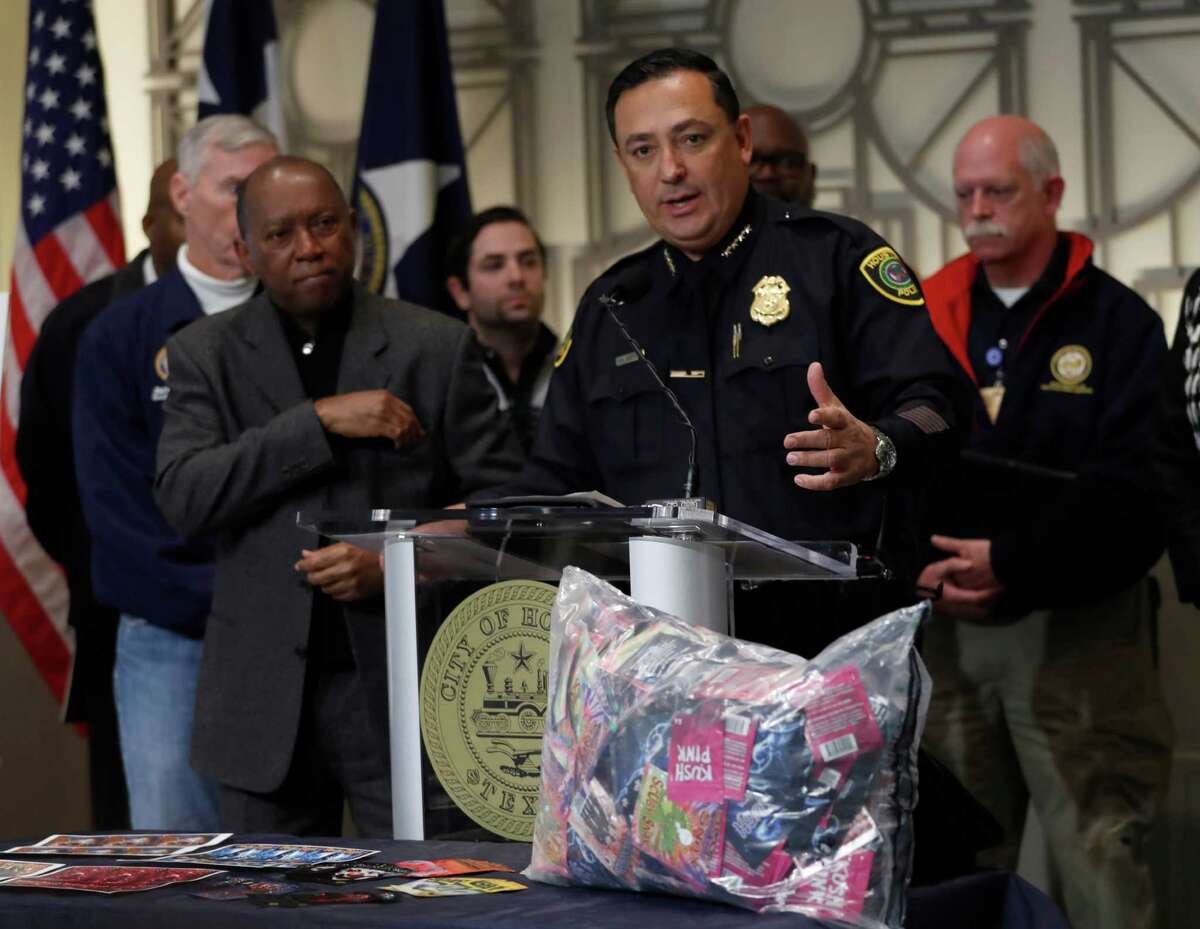 Houston Police Chief Art Acevedo speaks with Mayor Sylvester Turner during a press conference to announce a large Kush bust at City Hall, Friday,Dec. 9, 2016 in Houston.