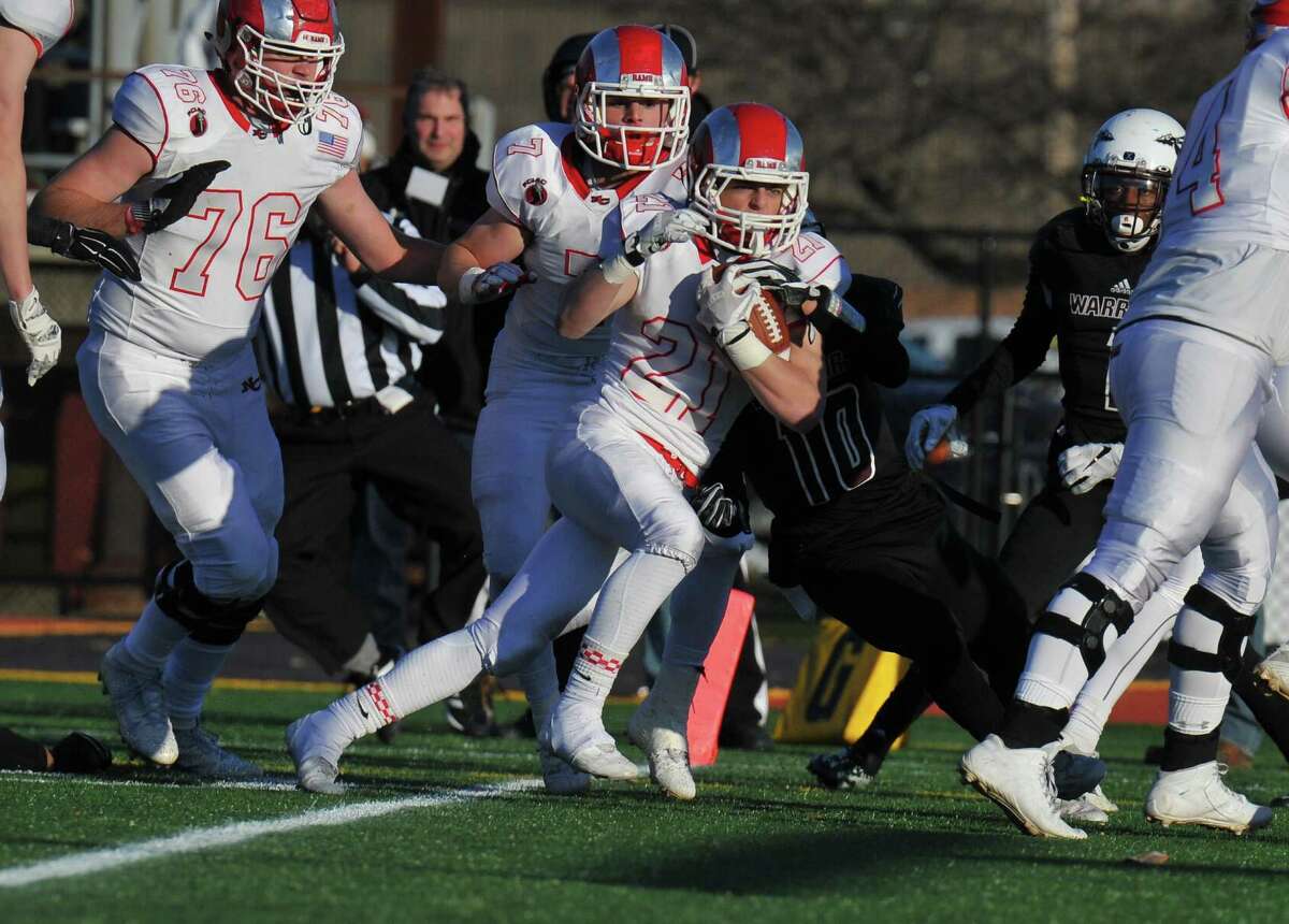 New Canaan’s Graham Braden crosses the goal line for a touchdown during the Class L state championship against Windsor Saturday in New Britain.