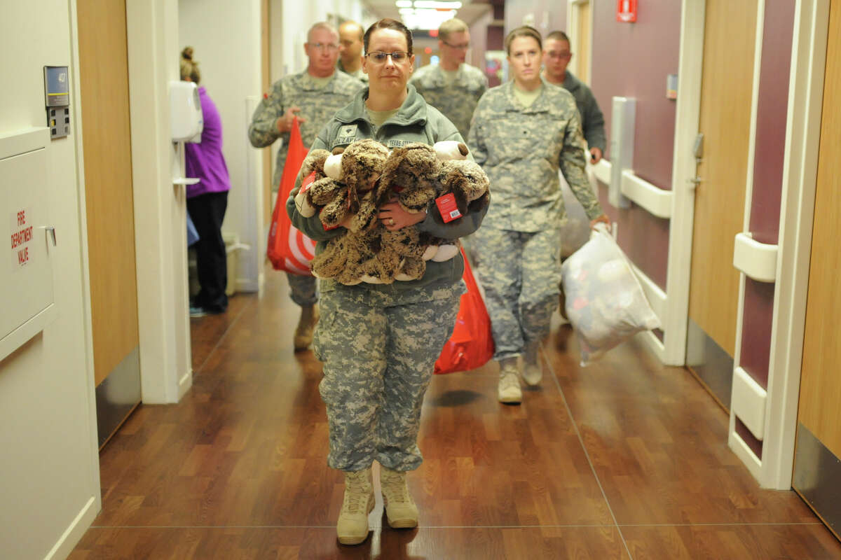 Members of the Texas State Guard deliver toys Saturday, Dec. 10, 2016 in the pediatric unit of Midland Memorial Hospital. James Durbin/Reporter-Telegram