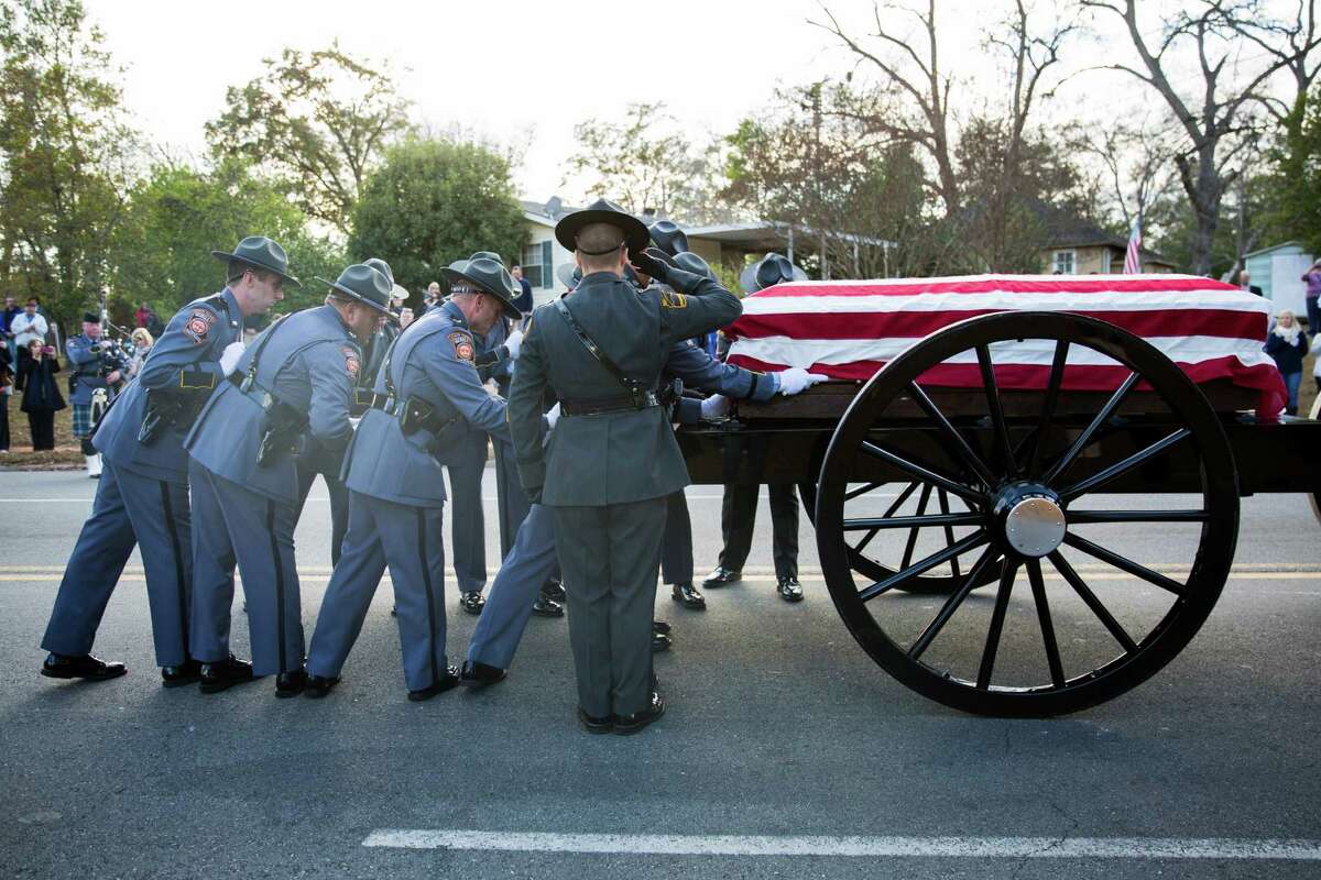 Hundreds honor slain officer at funeral