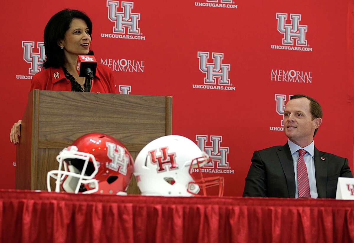 University of Houston President Renu Khator left, speaks as Major Applewhite right, looks on during a press conference announcing Applewhite as the next University of Houston football head coach at TDECU Stadium Dec. 12, 2016, in Houston. >>>See key plays from the Armed Forces Bowl ...