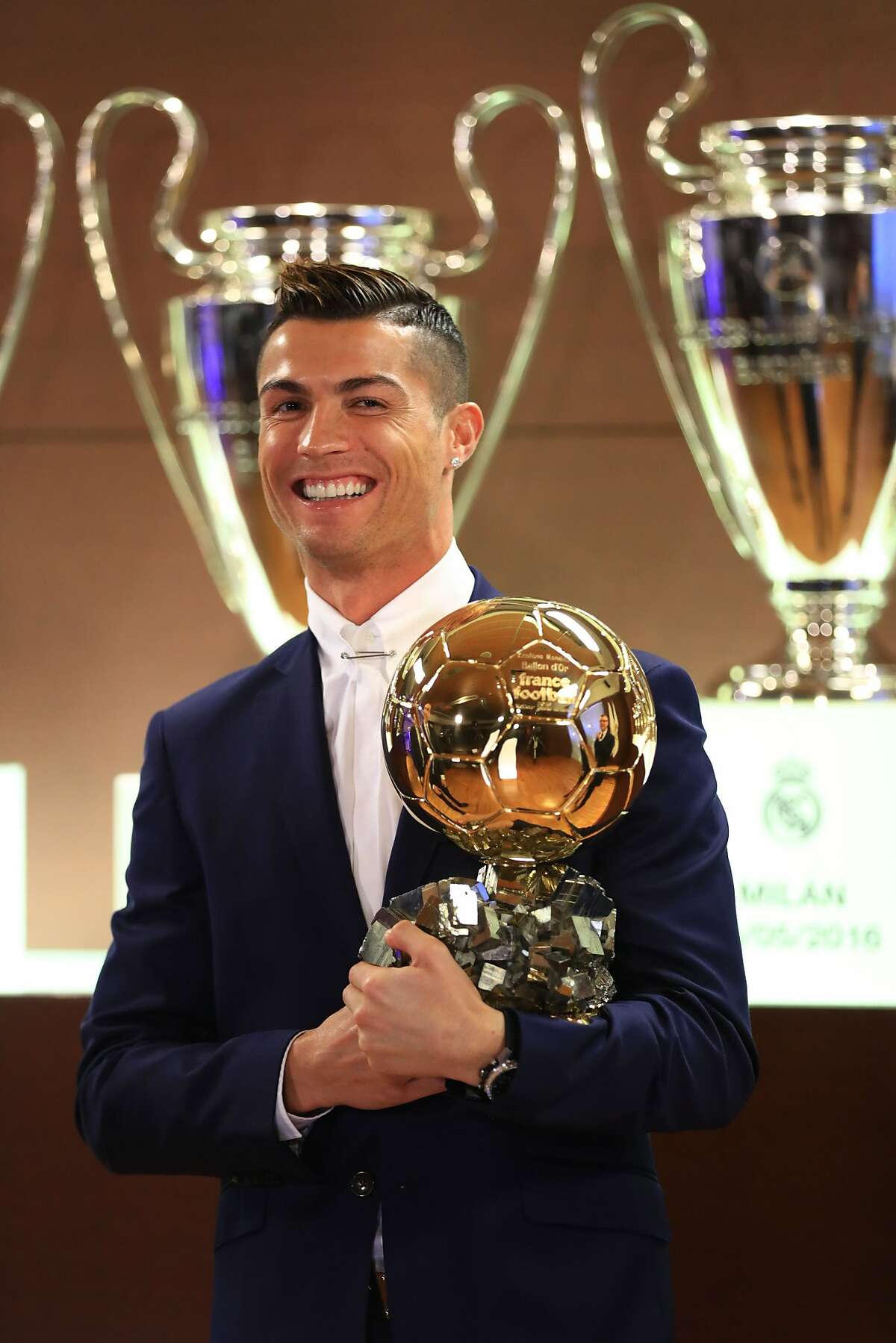 Handout photo released on December 12, 2016 by L'Equipe shows Portugese player Cristiano Ronaldo posing with the Ballon d'Or France Football trophy in Madrid. Cristiano Ronaldo was named winner of the Ballon d'Or on December 12, 2016 for the fourth time, organisers France Football said, capping a terrific year for the Real Madrid star. / AFP PHOTO / L'EQUIPE / FRANCK SEGUIN / RESTRICTED TO EDITORIAL USE - MANDATORY CREDIT "AFP PHOTO / FRANCK SEGUIN / LEQUIPE" - NO MARKETING NO ADVERTISING CAMPAIGNS - DISTRIBUTED AS A SERVICE TO CLIENTS FRANCK SEGUIN/AFP/Getty Images