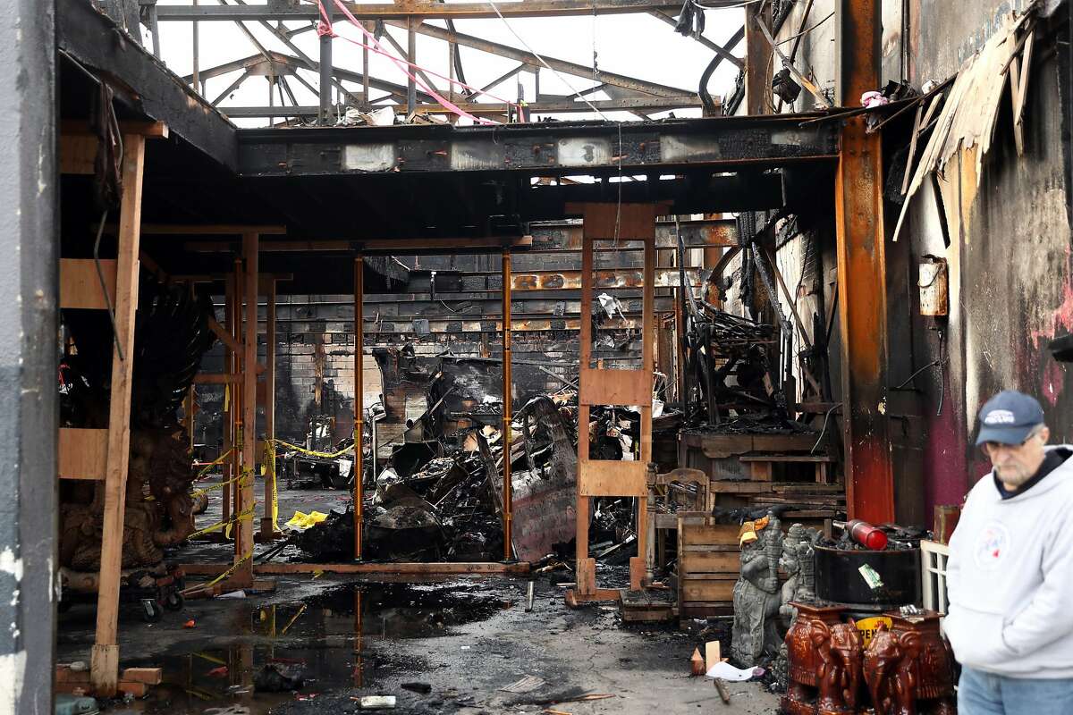 Investigators visit the scene of the deadly Ghost Ship warehouse fire in Oakland, Calif., on Monday, December 12, 2016.