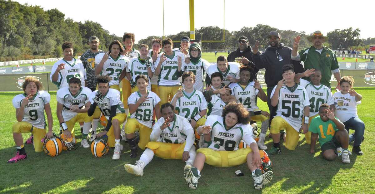 The Norwalk Packers U-13 football team pose for a team photo after winning the third-place game at the 2016 American Youth Football National Championship tournament last week.