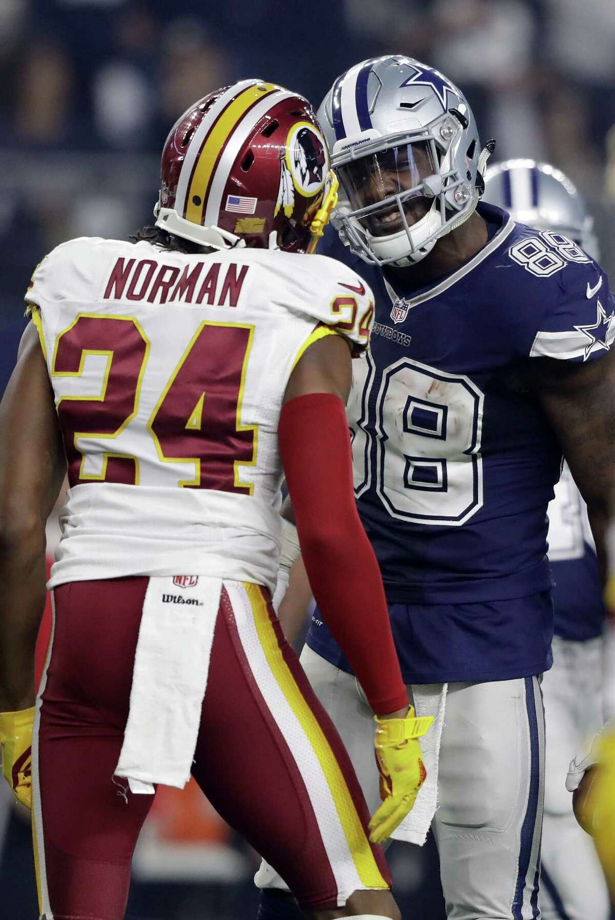 ARLINGTON, TX - NOVEMBER 24: Dez Bryant #88 of the Dallas Cowboys argues with Josh Norman #24 of the Washington Redskins after catching a pass in their game at AT&T Stadium on November 24, 2016 in Arlington, Texas. (Photo by Ronald Martinez/Getty Images) ORG XMIT: 663936901
