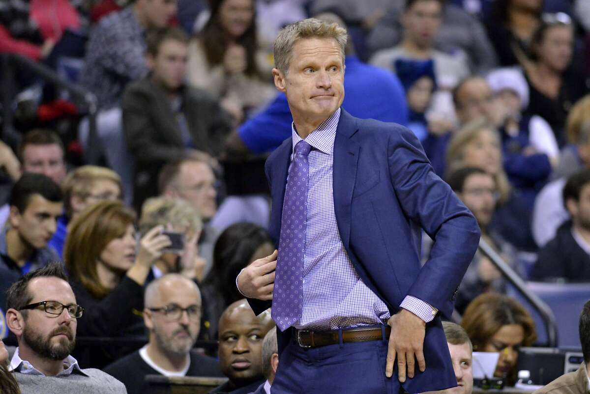 Golden State Warriors head coach Steve Kerr watches from the sideline in the first half of an NBA basketball game Saturday, Dec. 10, 2016, in Memphis, Tenn. (AP Photo/Brandon Dill)