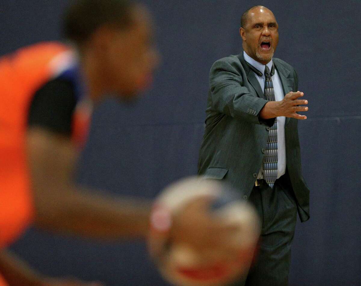 Former Spurs point guard Johnny Moore, now head coach of the Universal City Seraphim, yells instructions to the team during first-half action against the Texas Sky Riders on Dec. 3, 2016 at Northeast Lake View College gym.