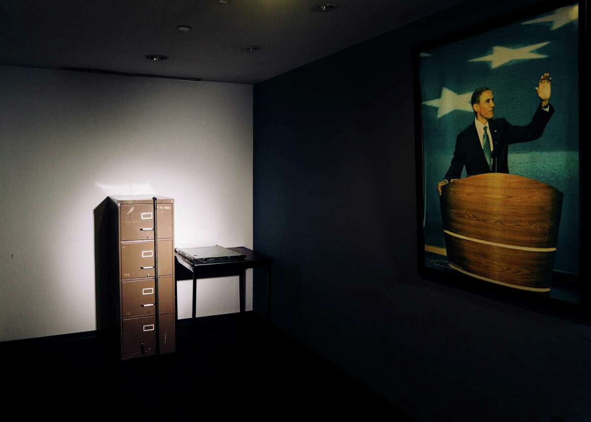 A filing cabinet broken into in 1972 as part of the Watergate burglary, beside a computer server that Russian hackers breached during the 2016 presidential campaign, both now in the basement of the Democratic National Committee’s headquarters in Washington, Dec. 12, 2016. An investigation into the Russian operation reveals a series of missed signals, slow responses and a continuing underestimation of its seriousness. (Justin T. Gellerson/The New York Times)